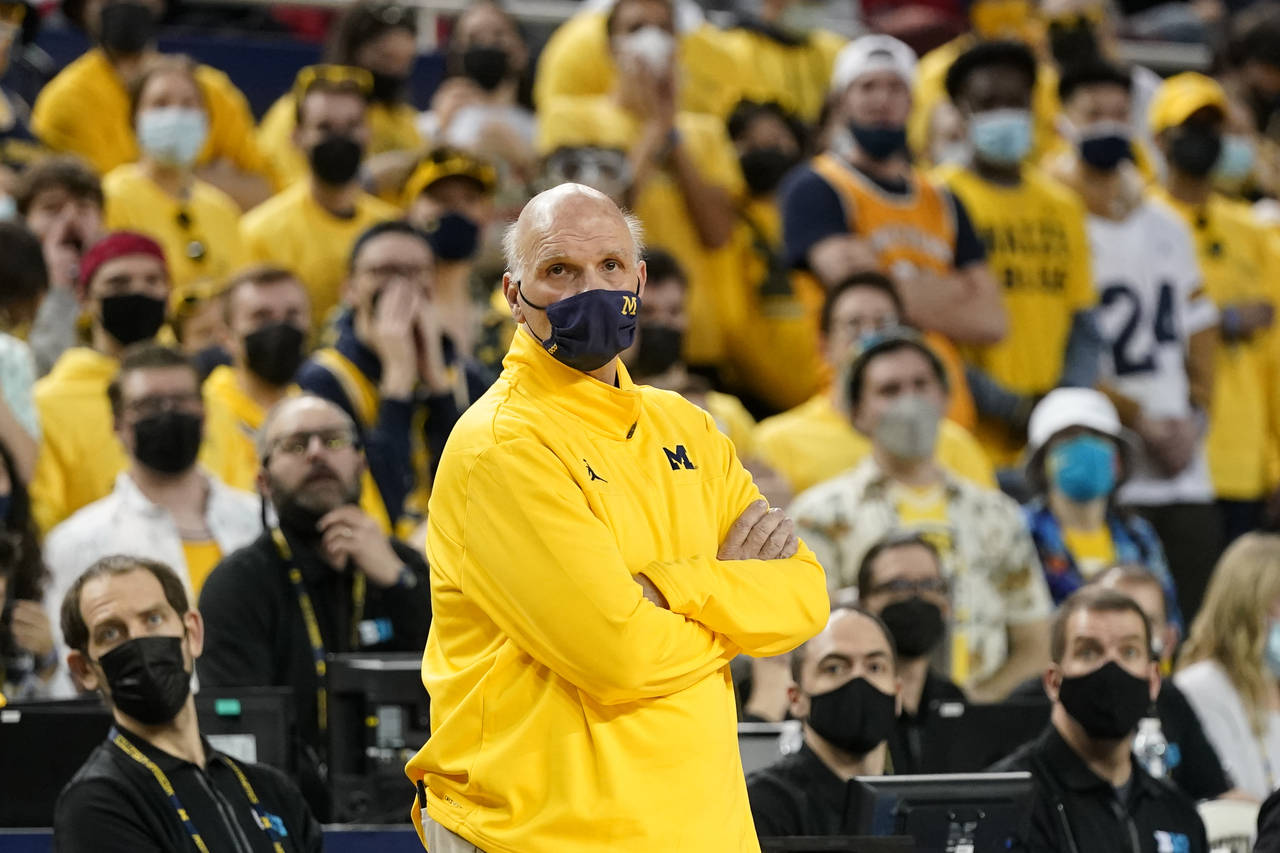 Michigan interim head coach Phil Martelli watches from the sideline during the first half of an NCA...