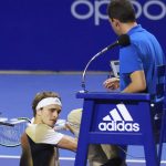 
              In this photo released by MexTenis, third-ranked Alexander Zverev of Germany smashes his racket on the umpire's chair moments after losing a doubles match of the Mexican Open tennis tournament in Acapulco, Mexico, Tuesday, Feb. 22, 2022. Zverev was thrown out of the Mexican Open after he struck the umpire's chair three times, sat for a moment, then got back up and yelled at umpire Alessandro Germani that he "destroyed the whole (expletive) match" and struck the chair once more with his racket as the umpire climbed down. (Marcos Dominguez/MexTenis via AP)
            