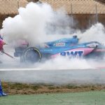 
              Alpine driver Fernando Alonso of Spain watches smoke pour from his car during a Formula One pre-season testing session at the Catalunya racetrack in Montmelo, just outside of Barcelona, Spain, Friday, Feb. 25, 2022. (AP Photo/Joan Monfort)
            
