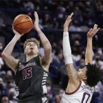 
              Santa Clara forward Jacob Holt (15) shoots while defended by Gonzaga guard Julian Strawther (0) during the first half of an NCAA college basketball game Saturday, Feb. 19, 2022, in Spokane, Wash. (AP Photo/Young Kwak)
            