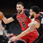 
              Chicago Bulls guard Zach LaVine (8) protects the ball from Toronto Raptors guard Fred VanVleet (23) during the first half of an NBA basketball game Thursday, Feb. 3, 2022, in Toronto. (Frank Gunn/The Canadian Press via AP)
            