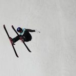 
              Eileen Gu of China competes during the women's freestyle skiing Big Air qualification round of the 2022 Winter Olympics, Monday, Feb. 7, 2022, in Beijing. (AP Photo/Jae C. Hong)
            