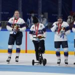 
              United States pose for photos after receiving their silver medals after being defeated by Canada in women's gold medal hockey game at the 2022 Winter Olympics, Thursday, Feb. 17, 2022, in Beijing. (AP Photo/Petr David Josek)
            