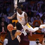 
              Tennessee guard Jahmai Mashack (15) flies over Texas A&M guard Aaron Cash (0) while defending during the first half of an NCAA college basketball game Tuesday, Feb. 1, 2022, in Knoxville, Tenn. (AP Photo/Wade Payne)
            
