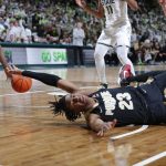 
              Purdue's Jaden Ivey, bottom, loses the ball on a drive to Michigan State's Julius Marble, left, during the first half of an NCAA college basketball game, Saturday, Feb. 26, 2022, in East Lansing, Mich. (AP Photo/Al Goldis)
            