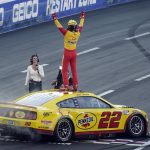 
              Joey Logano celebrates at the start/finish line after winning a NASCAR exhibition auto race at Los Angeles Memorial Coliseum, Sunday, Feb. 6, 2022, in Los Angeles. (AP Photo/Marcio Jose Sanchez)
            