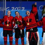 
              Canada goalkeeper Ann-Renee Desbiens raises her fist as the team receives their gold medals after the women's gold medal hockey game at the 2022 Winter Olympics, Thursday, Feb. 17, 2022, in Beijing. (AP Photo/Matt Slocum)
            