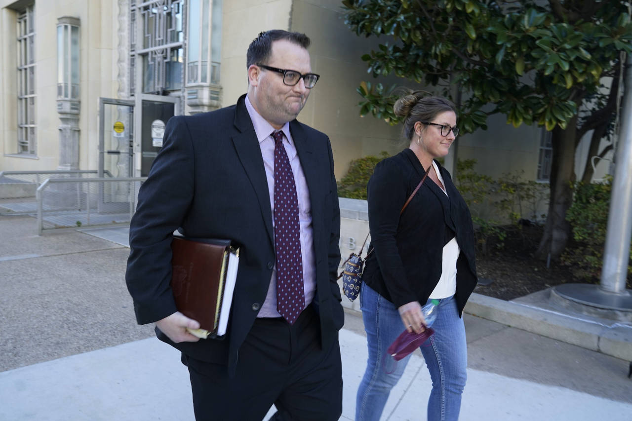 FILE - Former Los Angeles Angels employee Eric Kay, left, walks out of a federal court building whe...