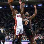 
              Miami Heat guard Kyle Lowry (7) shoots against New York Knicks guard Alec Burks (18) during the first half of an NBA basketball game Friday, Feb. 25, 2022, in New York. (AP Photo/Jessie Alcheh)
            