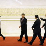 
              FILE- Vice Premiers, from left, Sun Chunlan, Hu Chunhua, and Liu He leave after a press conference following the closing session of China's National People's Congress (NPC) at the Great Hall of the People in Beijing, Tuesday, March 20, 2018. While Chinese women are strongly represented in the work force and in legislative bodies such as the National People's Congress, they are largely absent from the highest levels of Communist Party and government power. Sun is the only woman who sits on the 25-member Politburo and men make up all seven members of the all-powerful Politburo Standing Committee. China has never had a female president or premier or even foreign minister. (AP Photo/Mark Schiefelbein, File)
            