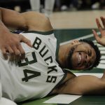 
              Milwaukee Bucks' Giannis Antetokounmpo reacts after being fouled during the second half of an NBA basketball game against the Washington Wizards Tuesday, Feb. 1, 2022, in Milwaukee. Antetokounmpo stayed in the game. (AP Photo/Aaron Gash)
            