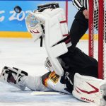 
              Germany goalkeeper Danny aus den Birken makes a save during a preliminary round men's hockey game against the United States at the 2022 Winter Olympics, Sunday, Feb. 13, 2022, in Beijing. (AP Photo/Petr David Josek)
            