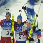 
              From left, Tarjei Boe of Norway, Quentin Fillon Maillet of France and Eduard Latypov of the Russian Olympic Committee celebrate after the men's 12.5-kilometer pursuit race at the 2022 Winter Olympics, Sunday, Feb. 13, 2022, in Zhangjiakou, China. (AP Photo/Frank Augstein)
            