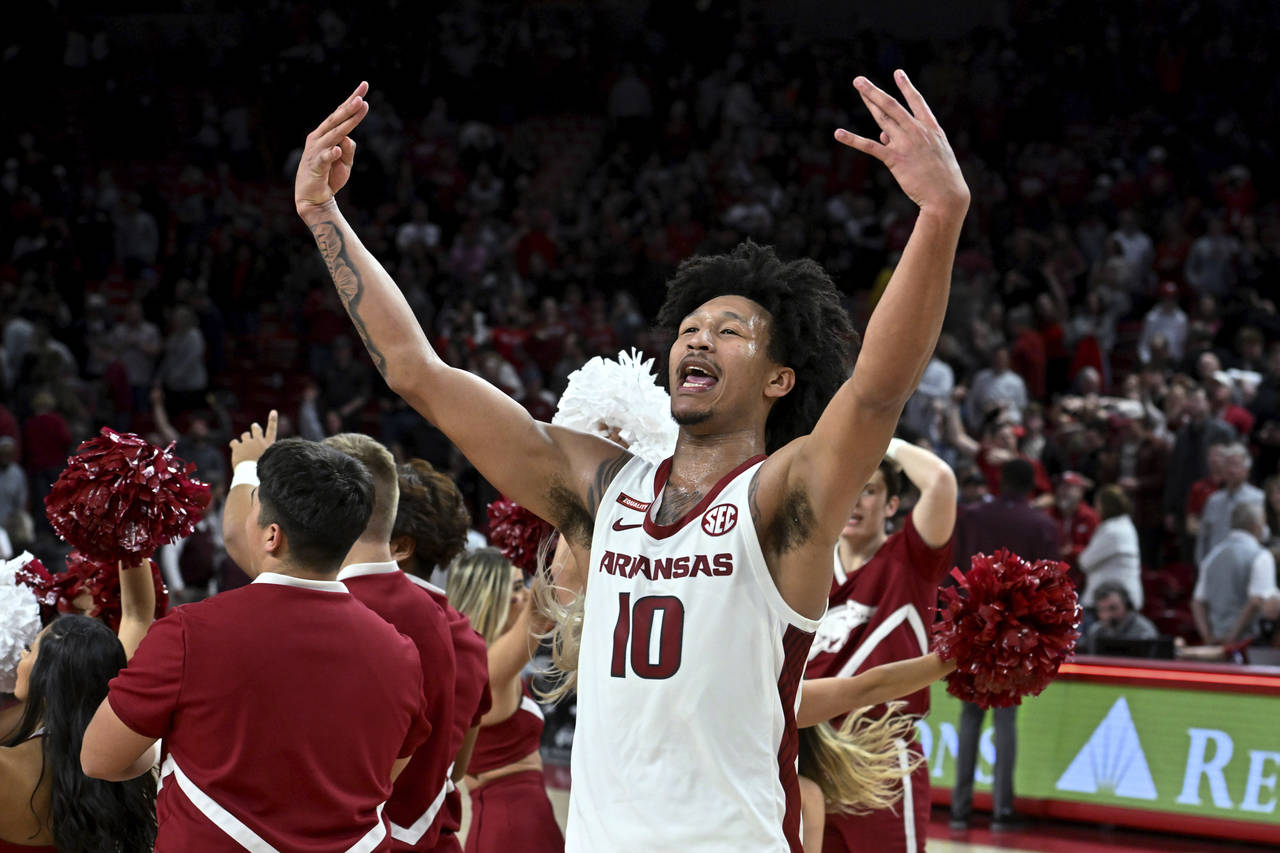 Arkansas forward Jaylin Williams celebrates the team's win over Mississippi State in an NCAA colleg...