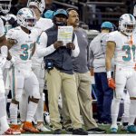 
              FILE - Miami Dolphins head coach Brian Flores, center, reacts to a call during an NFL football game against the New Orleans Saints, Monday, Dec. 27, 2021, in New Orleans. Fired Miami Dolphins Coach Brian Flores sued the NFL and three of its teams Tuesday, Feb. 1, 2022 saying racist hiring practices by the league have left it racially segregated and managed like a plantation.(AP Photo/Tyler Kaufman, File)
            