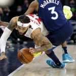 
              Toronto Raptors guard Gary Trent Jr. (33) is fouled by Minnesota Timberwolves forward Jaden McDaniels (3) during the second half of an NBA basketball game Wednesday, Feb. 16, 2022, in Minneapolis. (AP Photo/Andy Clayton-King)
            