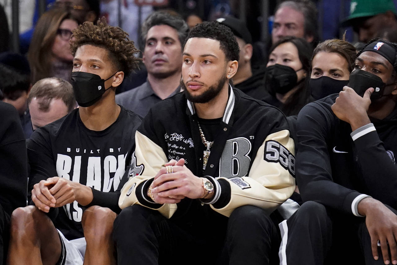 Brooklyn Nets forward Ben Simmons sits on the bench during the second half of an NBA basketball gam...