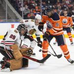 
              Chicago Blackhawks goalie Marc-Andre Fleury (29) makes a save on Edmonton Oilers' Evander Kane (91) during the second period of an NHL hockey game Wednesday, Feb. 9, 2022, in Edmonton, Alberta. (Jason Franson/The Canadian Press via AP)
            