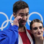 
              Gabriella Papadakis and Guillaume Cizeron, of France, react after winning the gold medal in the ice dance competition during the figure skating at the 2022 Winter Olympics, Monday, Feb. 14, 2022, in Beijing. (AP Photo/Bernat Armangue)
            
