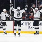 
              Los Angeles Kings' Anze Kopitar, right, celebrates his goal with Adrian Kempe, middle, and Alex Iafallo during the second period of the team's NHL hockey game against the Anaheim Ducks on Friday, Feb. 25, 2022, in Anaheim, Calif. (AP Photo/Jae C. Hong)
            