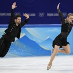 
              Madison Hubbell and Zachary Donohue, of the United States, compete during the ice dance team program in the figure skating competition at the 2022 Winter Olympics, Friday, Feb. 4, 2022, in Beijing. (AP Photo/Bernat Armangue)
            