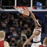 Gonzaga guard Andrew Nembhard dunks during the first half of the team's NCAA college basketball game against Saint Mary's, Saturday, Feb. 12, 2022, in Spokane, Wash. (AP Photo/Young Kwak)