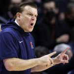 
              Illinois coach Brad Underwood gestures during the second half of the team's NCAA college basketball game against Rutgers on Wednesday, Feb. 16, 2022, in Piscataway, N.J. (AP Photo/Adam Hunger)
            