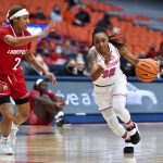 
              Syracuse guard Chrislyn Carr, right, is defended by Louisville guard Ahlana Smith during the second half of an NCAA college basketball game in Syracuse, N.Y., Sunday, Feb. 6, 2022. Louisville won 100-64. (AP Photo/Adrian Kraus)
            