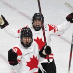 
              Canada's Brianne Jenner (19) celebrates with Marie-Philip Poulin (29) after Jenner scored a goal against the United States during a preliminary round women's hockey game at the 2022 Winter Olympics, Tuesday, Feb. 8, 2022, in Beijing. (AP Photo/Petr David Josek)
            