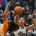 
              Connecticut's Azzi Fudd, right, blocks a shot by Tennessee's Jordan Walker in the first half of an NCAA college basketball game, Sunday, Feb. 6, 2022, in Hartford, Conn. (AP Photo/Jessica Hill)
            