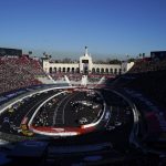 
              Competitors make a turn during a NASCAR exhibition auto race at Los Angeles Memorial Coliseum, Sunday, Feb. 6, 2022, in Los Angeles. (AP Photo/Marcio Jose Sanchez)
            