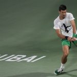 
              Serbia's Novak Djokovic trains a day ahead of the Dubai Duty Free Tennis Championship in Dubai, United Arab Emirates, Sunday, Feb. 20, 2022. (AP Photo/Kamran Jebreili)
            