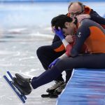 
              Kai Verbij of the Netherlands is comforted by coach Jac Orie after his heat in the men's speedskating 1,000-meter finals at the 2022 Winter Olympics, Friday, Feb. 18, 2022, in Beijing. (AP Photo/Sue Ogrocki)
            