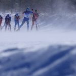 
              Wind blows snow as skiers compete during the women's 30km mass start free cross-country skiing competition at the 2022 Winter Olympics, Sunday, Feb. 20, 2022, in Zhangjiakou, China. (AP Photo/Alessandra Tarantino)
            