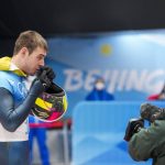 
              Vladyslav Heraskevych, of Ukraine, stands in the mixed zone after finishing the men's skeleton run 4 at the 2022 Winter Olympics, Friday, Feb. 11, 2022, in the Yanqing district of Beijing. (AP Photo/Mark Schiefelbein)
            