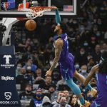 
              Charlotte Hornets forward Miles Bridges dunks against the Minnesota Timberwolves during the first half of an NBA basketball game Tuesday, Feb. 15, 2022, in Minneapolis. (AP Photo/Craig Lassig)
            