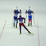 
              Johannes Thingnes Boe of Norway pulls ahead of Quentin Fillon Maillet of France, left, and Eduard Latypov of the Russian Olympic Committee at the finish line during the 4x6-kilometer mixed relay at the 2022 Winter Olympics, Saturday, Feb. 5, 2022, in Zhangjiakou, China. (AP Photo/Kirsty Wigglesworth)
            