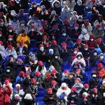 
              Spectators wait for the start of the opening ceremony of the 2022 Winter Olympics, Friday, Feb. 4, 2022, in Beijing. (AP Photo/David J. Phillip)
            