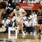 
              Colorado State's David Roddy (21) runs in transition during the first half of an NCAA college basketball game against Wyoming Wednesday, Feb. 23, 2022 in Fort Collins, Colo. (AAron Ontiveroz/The Denver Post via AP)
            