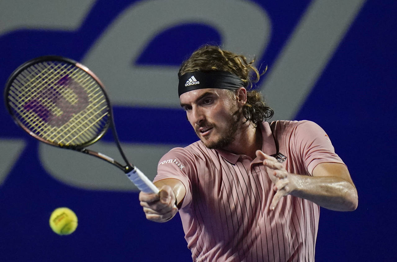Stefanos Tsitsipas, of Greece, hits a forehand to Laslo Djere, of Serbia, at the Mexican Open tenn...