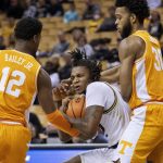 
              Missouri's DaJuan Gordon, center, pulls the ball away from Tennessee's Josiah-Jordan James, right, and Victor Bailey Jr. during the first half of an NCAA college basketball game Tuesday, Feb. 22, 2022, in Columbia, Mo. (AP Photo/L.G. Patterson)
            