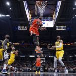 
              Chicago Bulls forward Javonte Green (24) dunks in front of Indiana Pacers forward Oshae Brissett (12) during the first half of an NBA basketball game in Indianapolis, Friday, Feb. 4, 2022. The Bulls won 122-115. (AP Photo/AJ Mast)
            