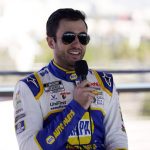 
              Chase Elliott answers questions after a practice session at the Los Angeles Memorial Coliseum, Saturday, Feb. 5, 2022, in Los Angeles, ahead of a NASCAR exhibition auto race. (AP Photo/Marcio Jose Sanchez)
            