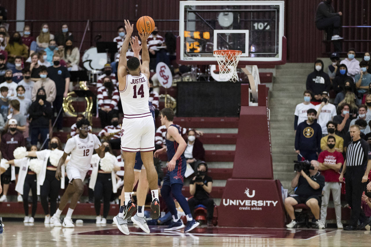 Santa Clara forward Keshawn Justice (14) takes a 3-point shot against Saint Mary's during the first...
