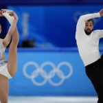 
              Ashley Cain-Gribble and Timothy Leduc, of the United States, compete in the pairs short program during the figure skating competition at the 2022 Winter Olympics, Friday, Feb. 18, 2022, in Beijing. (AP Photo/Natacha Pisarenko)
            