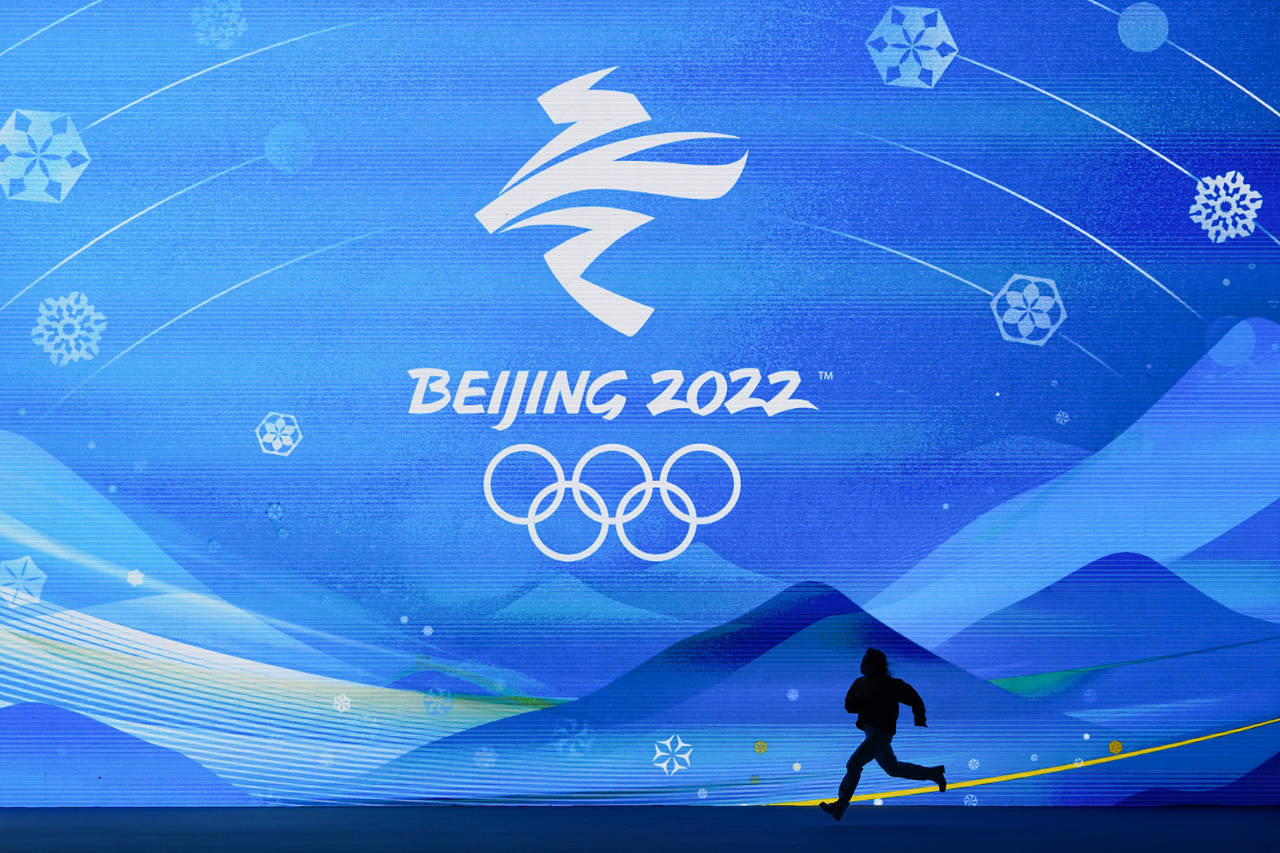 A performer runs across the stage during a rehearsal for the medal ceremonies ahead of the 2022 Win...