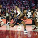 
              Auburn guard Wendell Green Jr. (1) drives between Georgia's Aaron Cook (10) and Kario Oquendo (3) during the second half of an NCAA college basketball game Saturday, Feb. 5, 2022, in Athens, Ga. (AP Photo/John Bazemore)
            