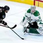 
              Dallas Stars goaltender Jake Oettinger (29) makes a save on a shot by Arizona Coyotes center Travis Boyd (72) during the first period of an NHL hockey game Sunday, Feb. 20, 2022, in Glendale, Ariz. (AP Photo/Ross D. Franklin)
            