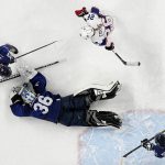 
              Finland goalkeeper Anni Keisala (36) covers up puck as Julia Liikala (27) and United States' Kendall Coyne Schofield (26) watch for the rebound during a preliminary round women's hockey game at the 2022 Winter Olympics, Thursday, Feb. 3, 2022, in Beijing. (AP Photo/Petr David Josek)
            