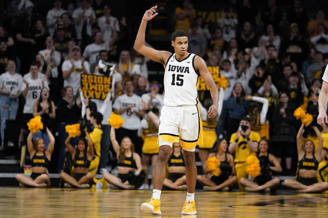 Iowa forward Keegan Murray (15) celebrates after making a 3-point basket during the second half of ...